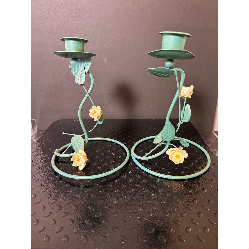 vintage metal candlestick holders in a green ivy finish featuring yellow flowers